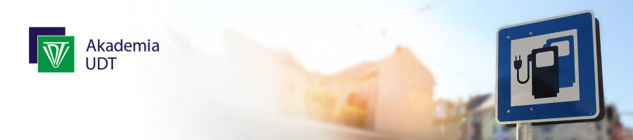 Tablica z ikoną dystrybutara do aut elektrycznych na tle nieba